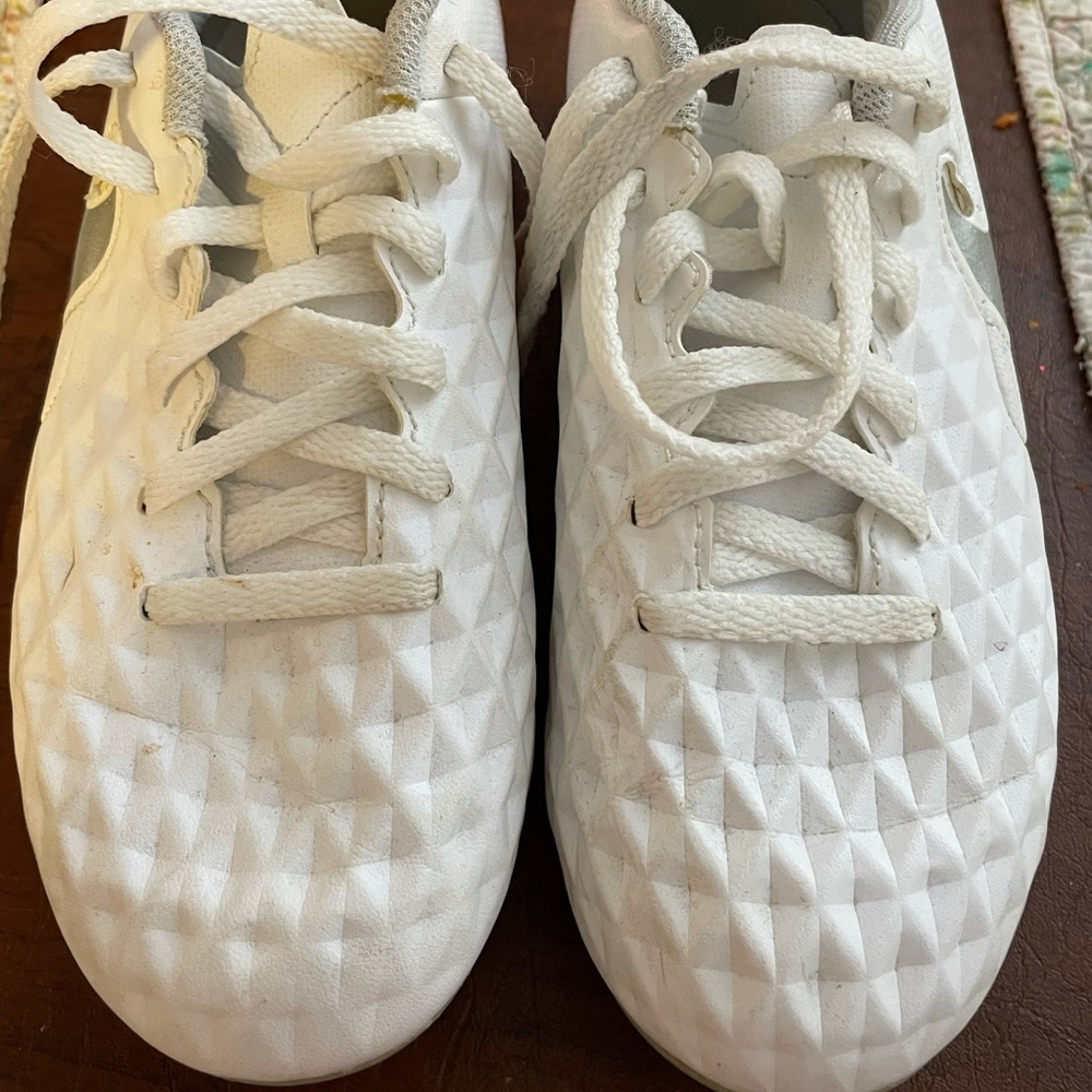 Girls white Nike cleats size 2.5